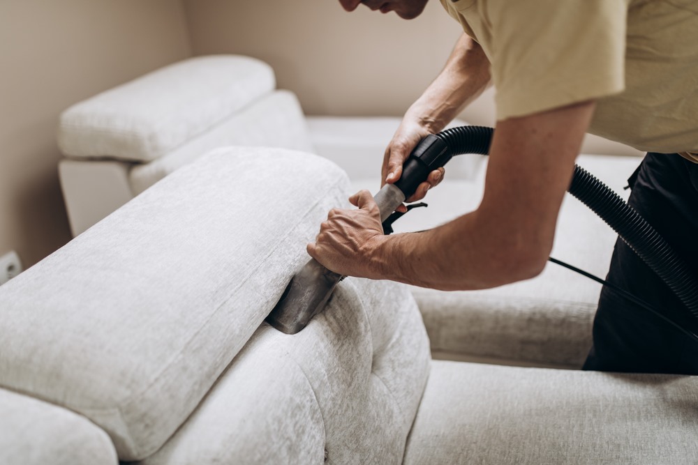 Professional deep cleaning of a sofa in Dubai, demonstrating the detailed process and associated costs of upholstery cleaning services.