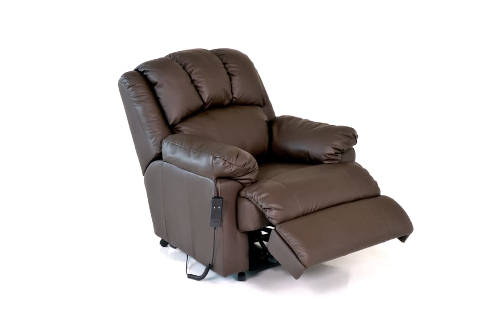 Brown leather single-seater recliner chair with control panel, ideal for professional furniture cleaning as part of deep cleaning services in Dubai.