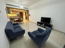 Furnished one-bedroom apartment living room cleaned and organized by professional home deep cleaning services in Dubai, ensuring a spotless and inviting atmosphere.