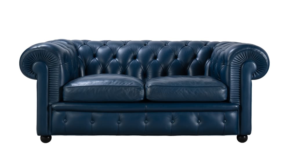 Luxurious blue two-seater leather sofa cleaning service in Dubai for deep stain removal and conditioning.
