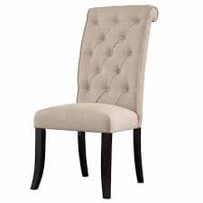 Elegant tufted fabric dining chair with dark wooden legs, perfect for deep cleaning and stain removal by Klean Kare's professional sofa and upholstery cleaning services.
